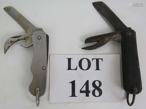 Two 20th Century military jack knives, one with black diamon...