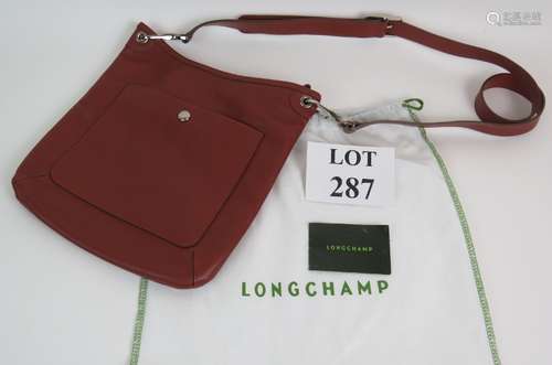 A Longchamp Le Foulonné grained leather cross body handbag w...