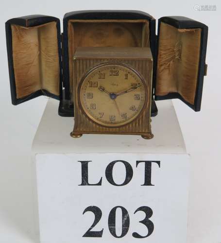 An Asprey gilt cased travel alarm clock with Swiss Zenith mo...