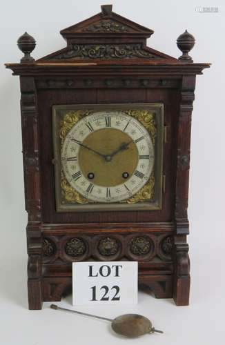 An Edwardian oak cased mantel clock,