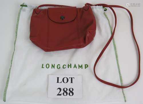 A Longchamp Le Pliage butter soft leather cross body handbag...