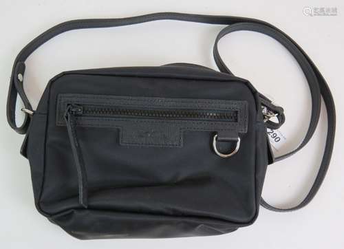 A Longchamp black nylon cross body bag with leather trim and...