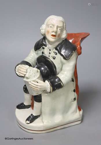 A Wood type pearlware seated Toby jug, height 20cm