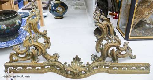 A pair of 19th century French rococo style ormolu andirons w...