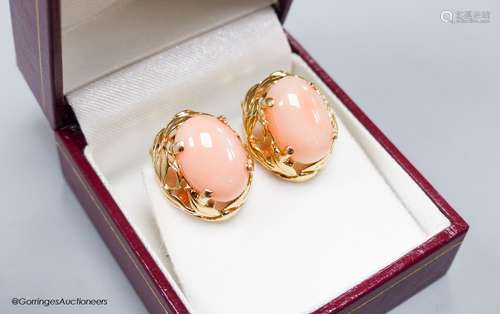 A modern pair of yellow metal (stamped 14k) and oval coral b...