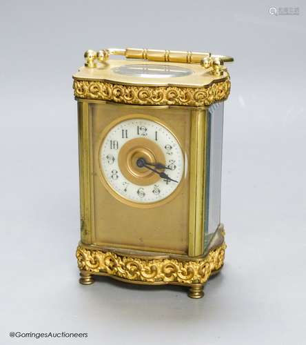 An Edwardian serpentine brass carriage timepiece, height 12c...