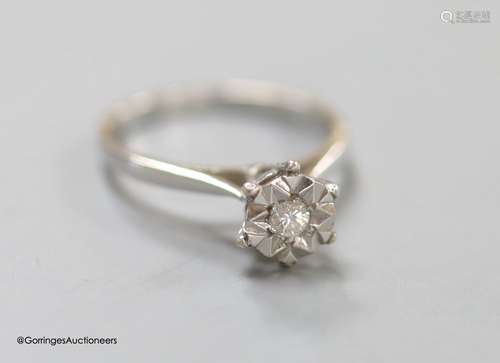 A modern 18ct white gold and illusion set solitaire diamond ...