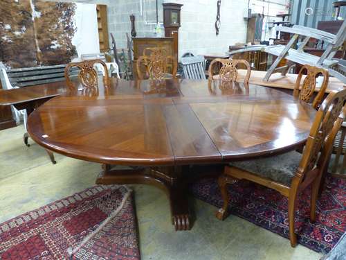 A Jupes patent style mahogany extending circular dining tabl...