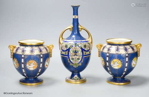 A pair of Royal Worcester powder blue vases and another simi...