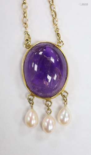 A modern yellow metal mounted, oval amethyst pebble and thre...