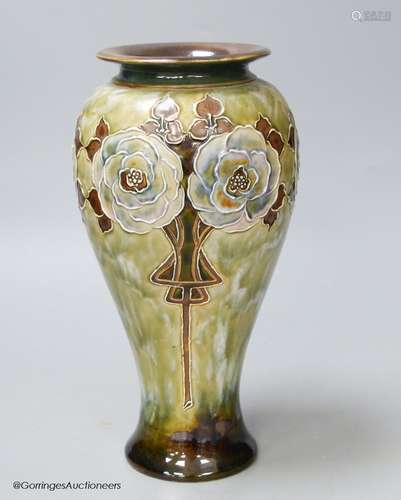 A Royal Doulton stoneware vase decorated with white roses by...