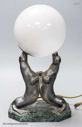 An Art Deco spelter and marble sea-lion desk lamp, height 34...