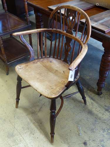 An early 19th century yew and elm Windsor kitchen elbow chai...