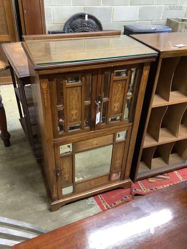 A late Victorian inlaid mirrored rosewood music cabinet, wid...