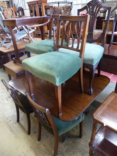 A set of four Sheraton style mahogany dining chairs, one wit...