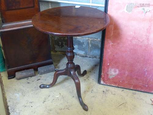 A George III circular mahogany tilt top tripod table, 58cm d...