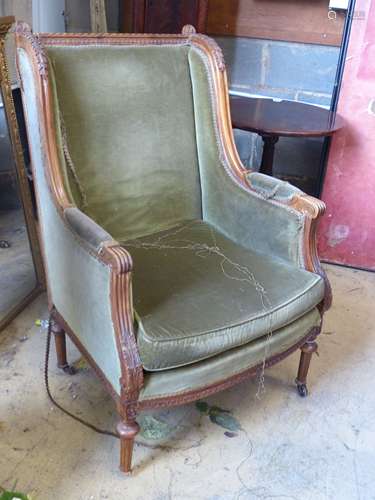 A Louis XVI style walnut framed fauteuil, with green dralon ...