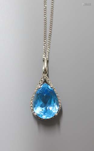 A modern white metal (stamped 9k), blue topaz and diamond ch...