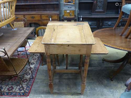 A Victorian pine clerk's desk,with sloping top, side flaps a...