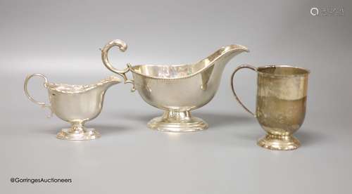 A Victorian silver cream boat, a small silver pedestal helme...