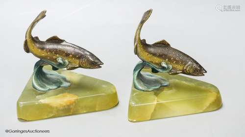 A pair of cold painted bronze fish bookends, on onyx bases, ...