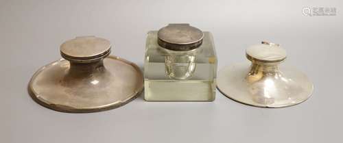 Three assorted silver mounted inkwells including two capstan...