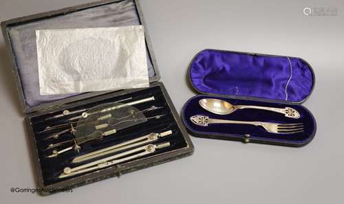 A cased Victorian silver christening spoon and fork, with pi...