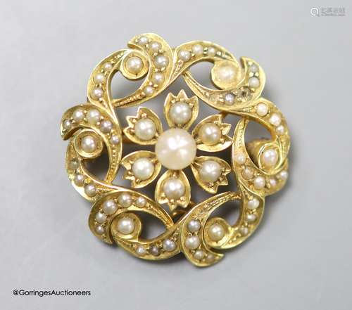 A late Victorian 15ct and seed pearl circular cluster pendan...