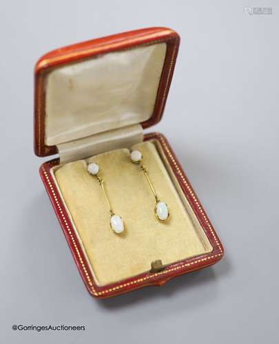 A pair of 9ct and two stone white opal set drop earrings, 36...