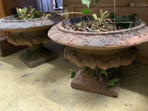 A pair of terracotta campana garden urns, diameter 44cm, hei...