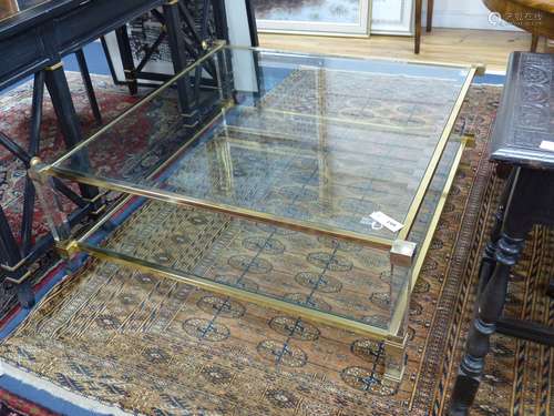 A contemporary square two tier brass framed glass coffee tab...