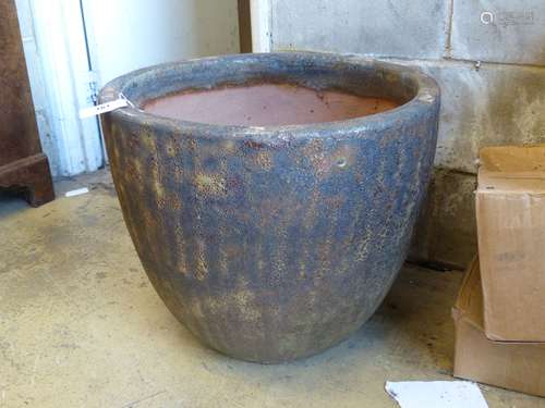 A large glazed earthenware garden planter, diameter 57cm, he...