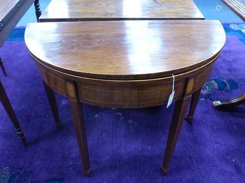 A George III inlaid demi lune folding tea table, width 93cm,...