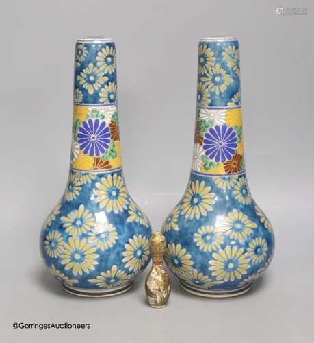 A pair of Japanese Satsuma pottery bottle vases by Taizan Yo...