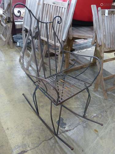 A contemporary wrought iron rocking chair, width 66cm, heigh...