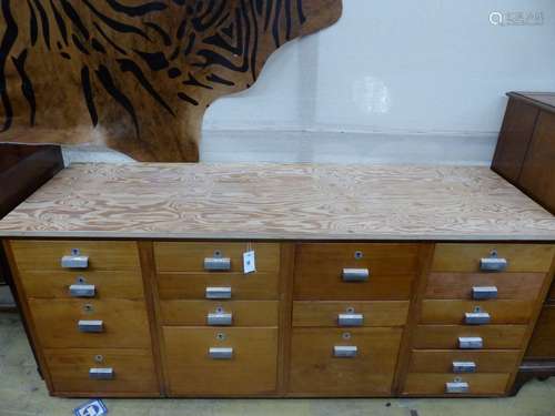 A mid century design 17 drawer teak habadashery cabinet with...