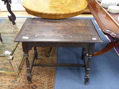 An early 20th century rectangular carved oak occasional tabl...