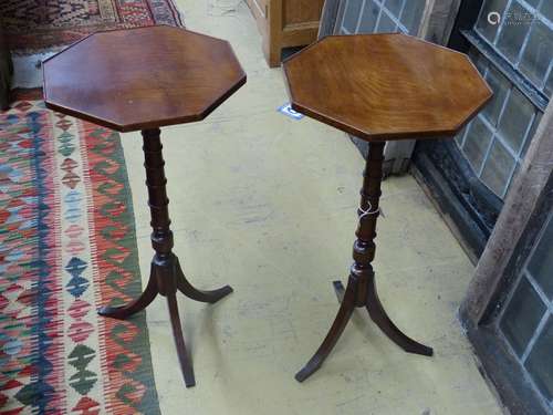 A pair of Regency style mahogany octagonal wine tableson rin...