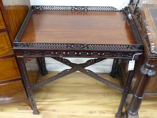 A George III style pierced mahogany side table (with damage)...