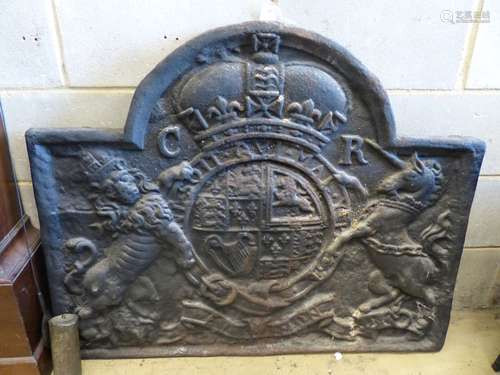 A large cast iron fireback, width 102cm, height 83cm