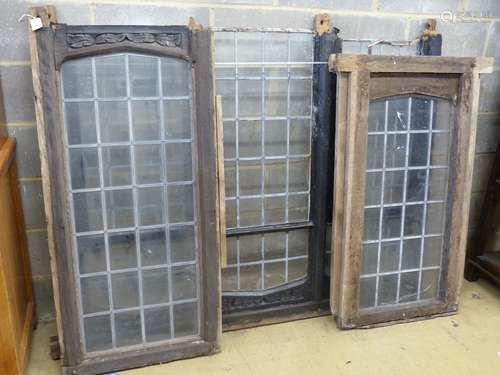 Three old carved oak window frames with leaded lights, large...