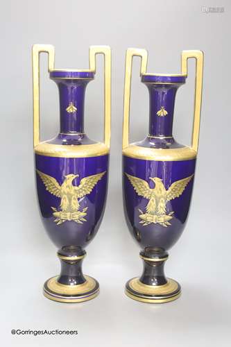 A pair of French gilt blue porcelain two handled vases, heig...