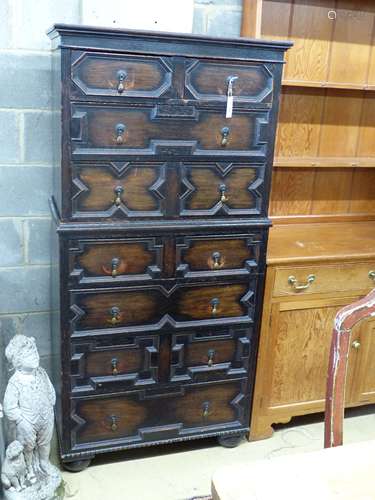 A 1920's narrow oak chest on chest, width 82cm depth 45cm he...