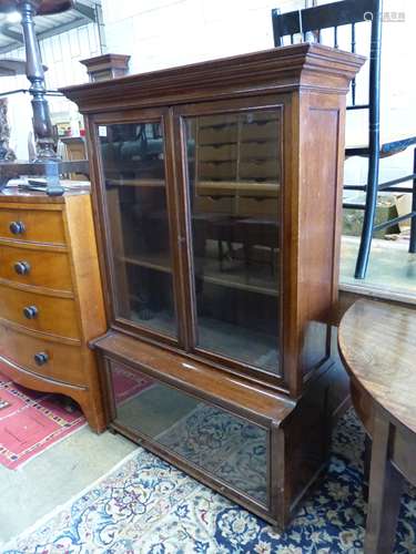 A 1920's standard oak bookcase, length 97cm, depth 37cm, hei...