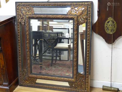 A 19th century Dutch ebonised and gilt metal mounted mirror,...