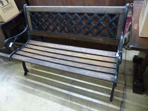 A painted cast metal slatted garden bench, length 127cm, dep...