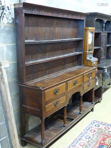 A late 18th/early 19th century oak dresser,having two-tier b...