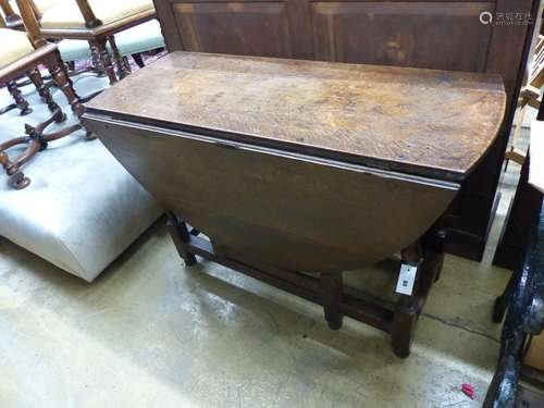 An 18th century oval oak gateleg dining table, length 135cm ...