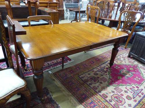 A Victorian mahogany extending dining table (one additional ...