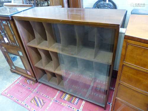 A mid century glazed teak eighteen section record cabinet, l...